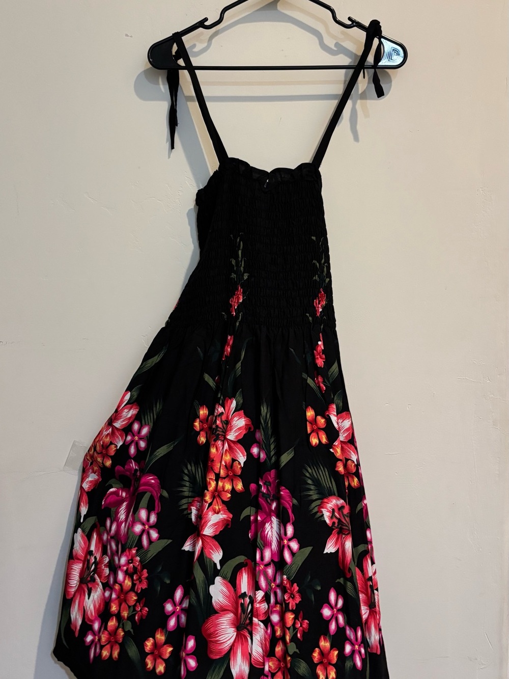 Hawaiian smocked sundress: vibrant red/pink floral print against black ONE SIZE